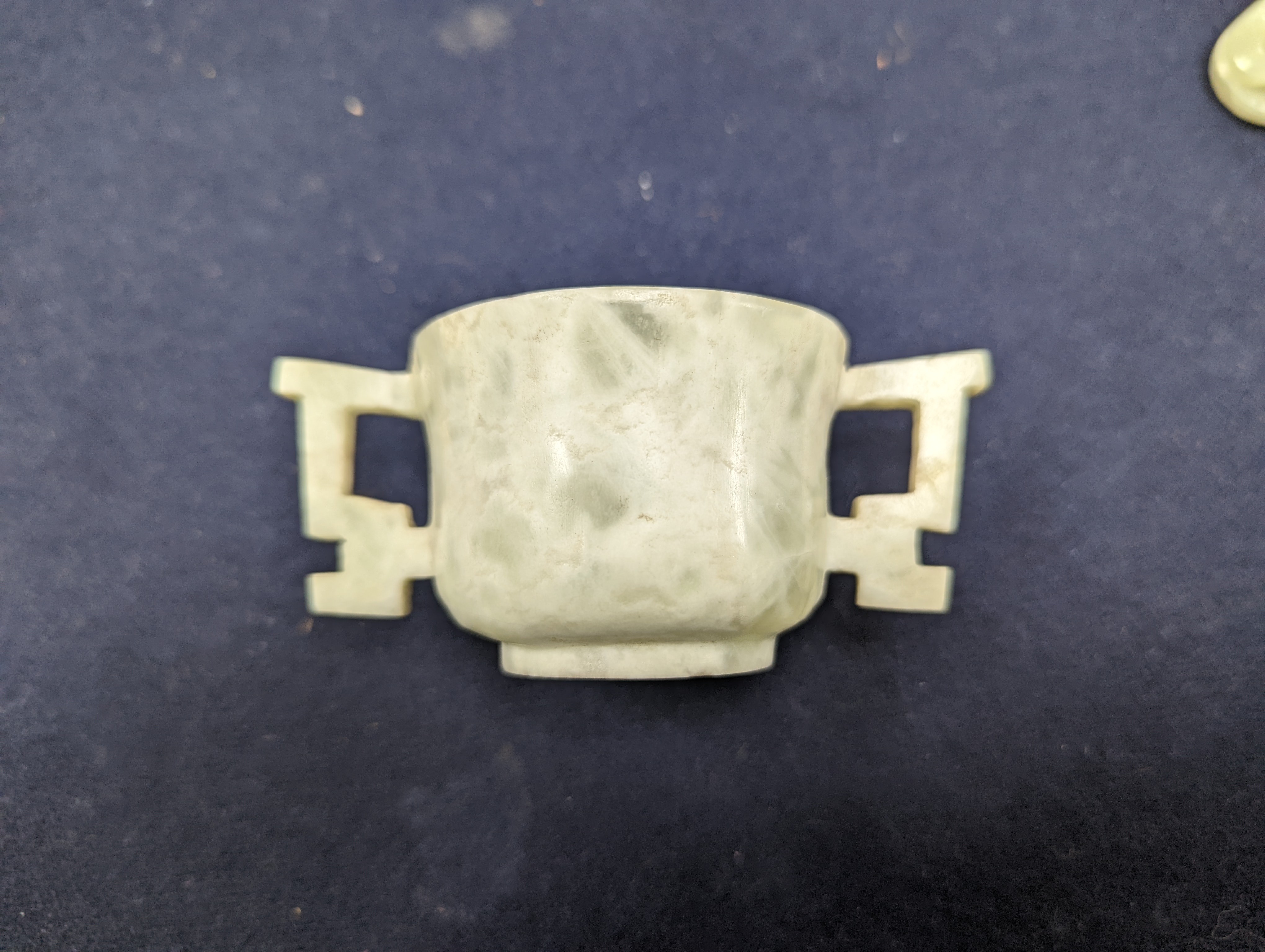 A Chinese jade belt hook, 12.5cm an archer's ring and figure, a stone cup and a glass snuff bottle